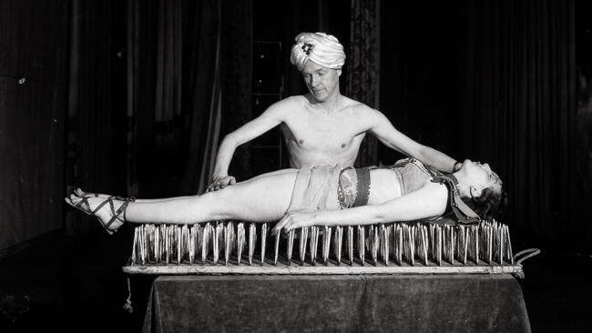 #5 A fakir performing the bed of nails trick, 1955.