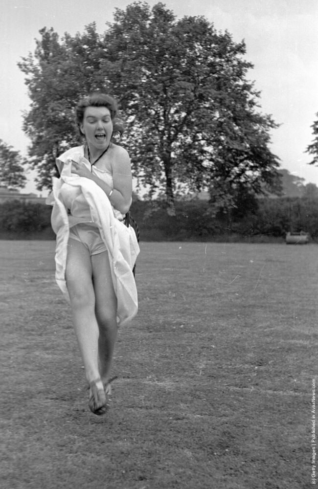 #23 A student shows a little more leg than necessary at a cricket match at the Goldsmith’s Art College end of term party in London, 1939.