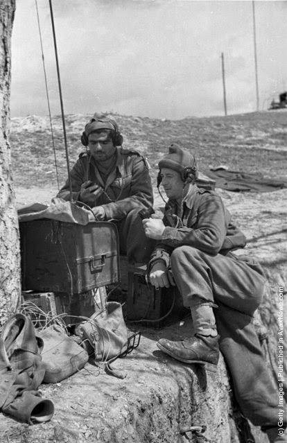 #10 A pair of Greek soldiers make contact with their troops on a field radio during the Greek Civil War, 1948.