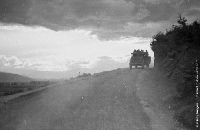 The last transport of the night makes its way along a lonely mountain road during the Greek Civil War, 1948.