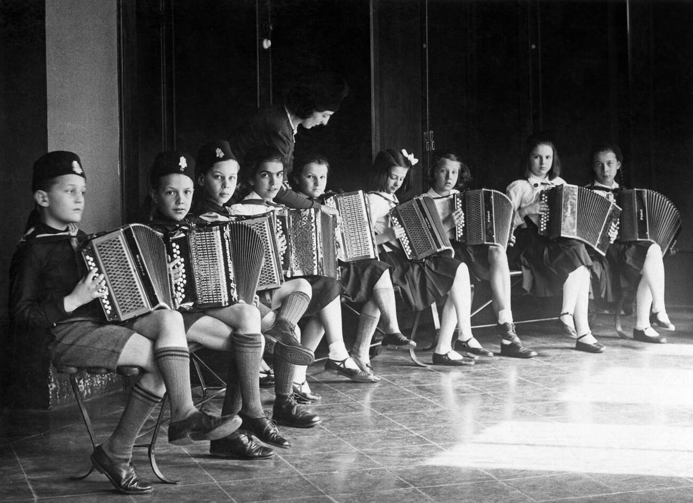 #70 Some Balilla and Piccole Italiane attending an accordion course, Italy, 1930s.