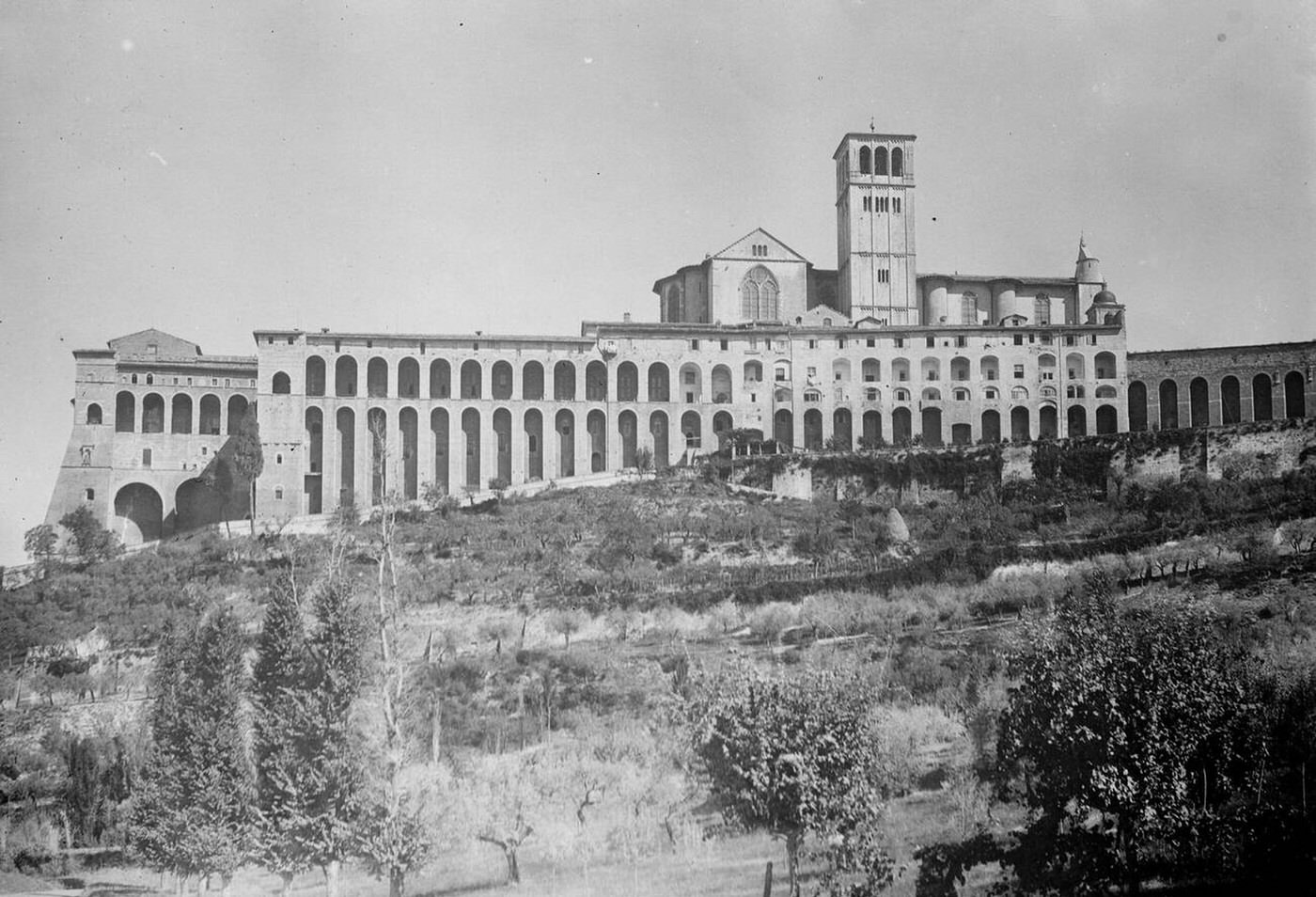#75 A striking view of Assisi, showing the upper and lower Basilicas of St Francis, 1930.
