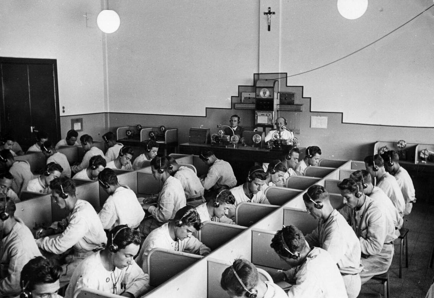 #83 Radio operators during a lesson, aviation school of the Regia Aeronautica, Italy, 1930s.