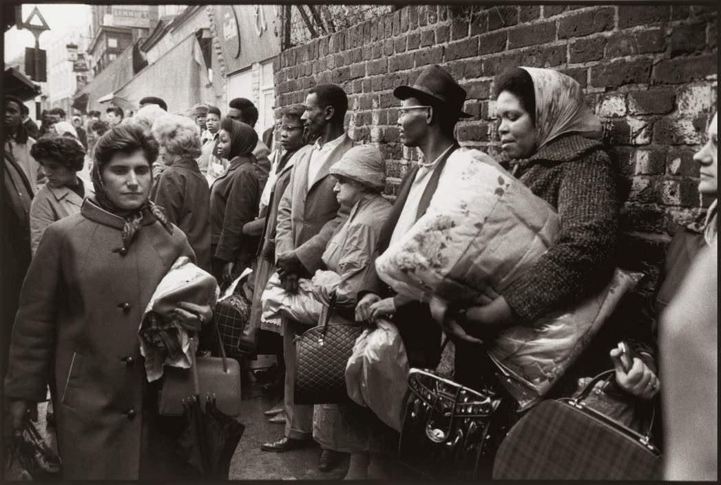 #18 Bus queue in Brixton, South London.