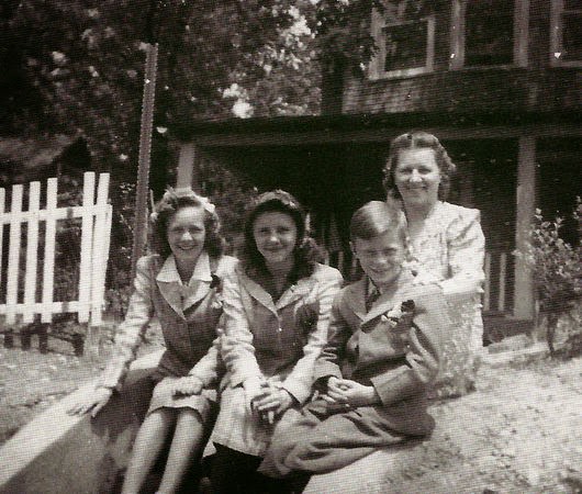 #16 Mary Hofacker sits on the step in front of her family’s home on West Fourth Avenue in Pine Hill with her children, Mary, Georgeanna and George Jr., 1943.
