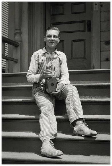 A young fellow with a large Kodak box camera, probably posed during the early 1930’s in America.