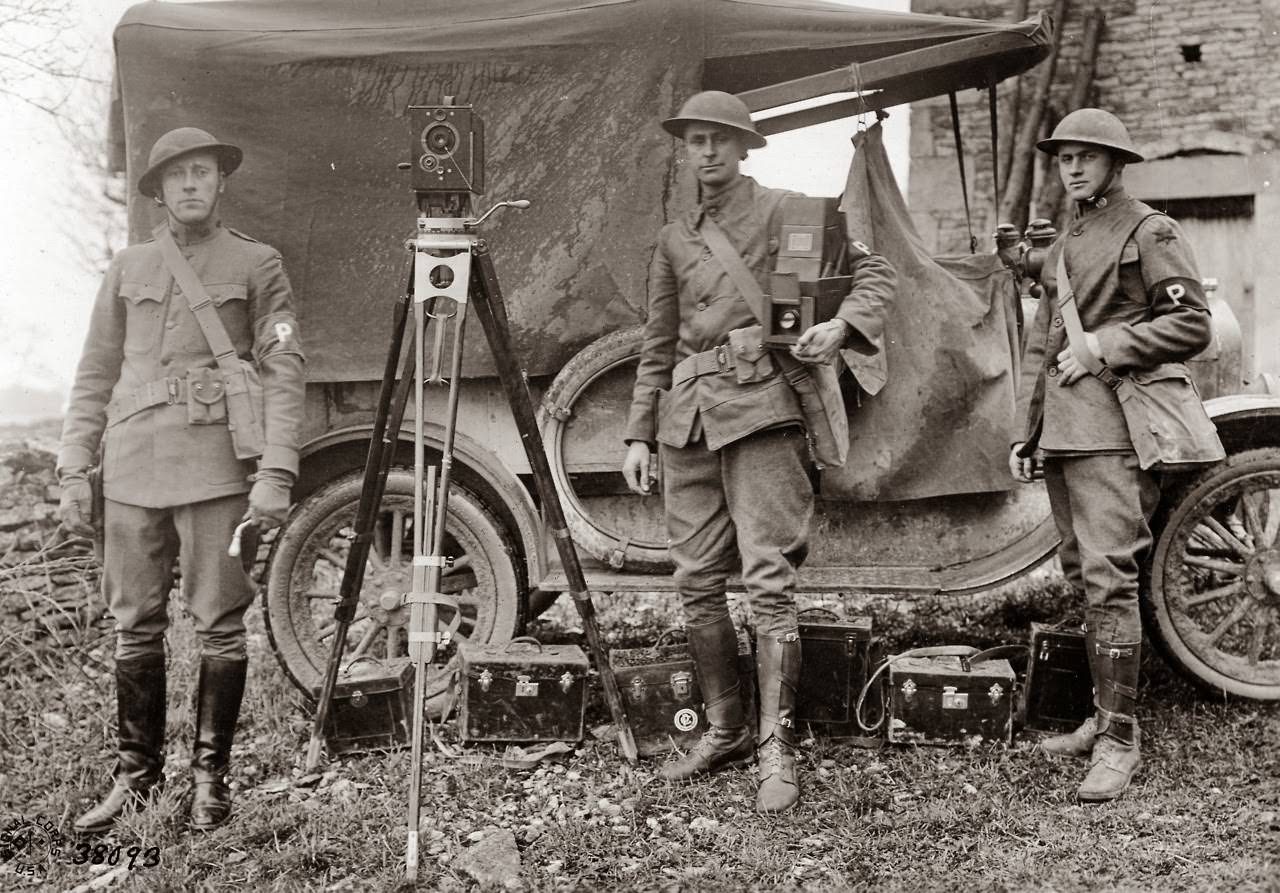 6th Division Photographic Unit: Lt. J.C. Zimmerman, Sgt 1st Cl E.R. Tarbold, and Pvt Lannis P. Gologhtly.