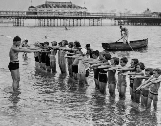 #11 Youngsters at Brighton get their feet wet while learning proper form on August 20, 1934.