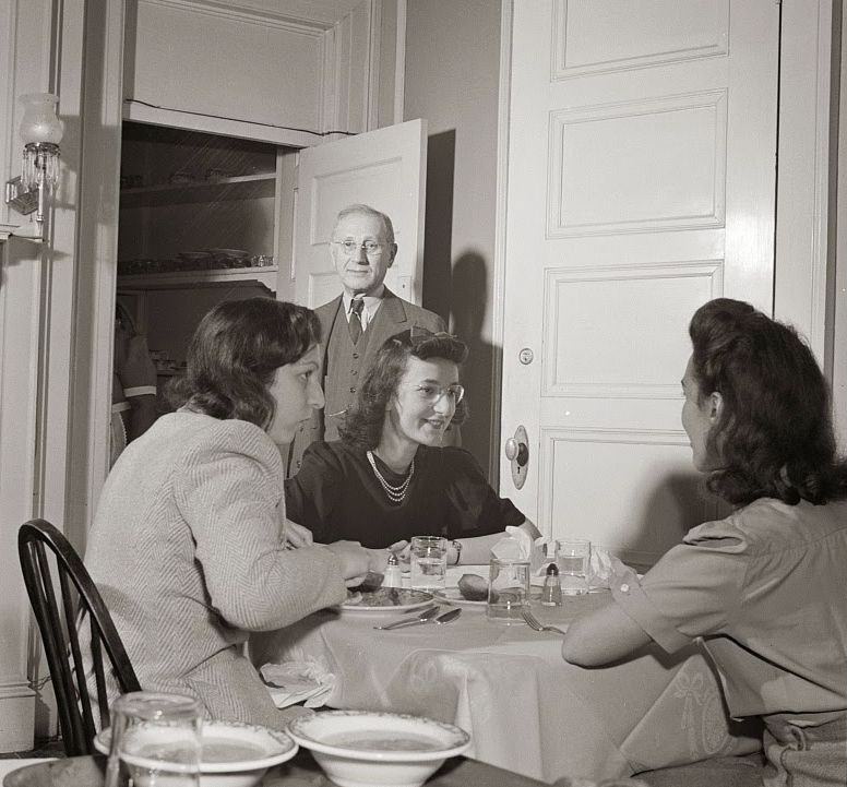 #11 The proprieter of this boardinghouse watches the service at dinner