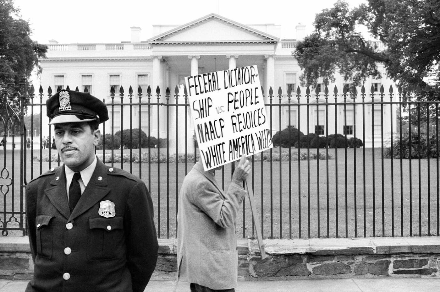 Man protesting for John Kasper, an American far-right activist and Ku Klux Klan member who took a militant stand against racial integration, Washington, D.C., 1957.