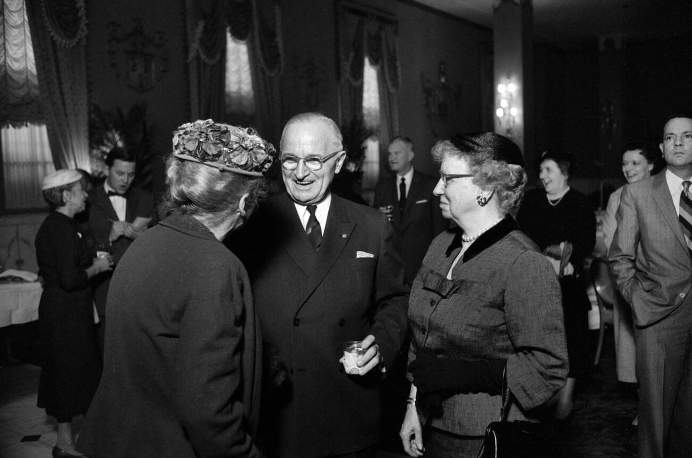 Former U.S. President Harry Truman with his wife, Bess Truman, greeting guests at luncheon held for his former cabinet members, Mayflower Hotel, Washington, D.C., 1958.