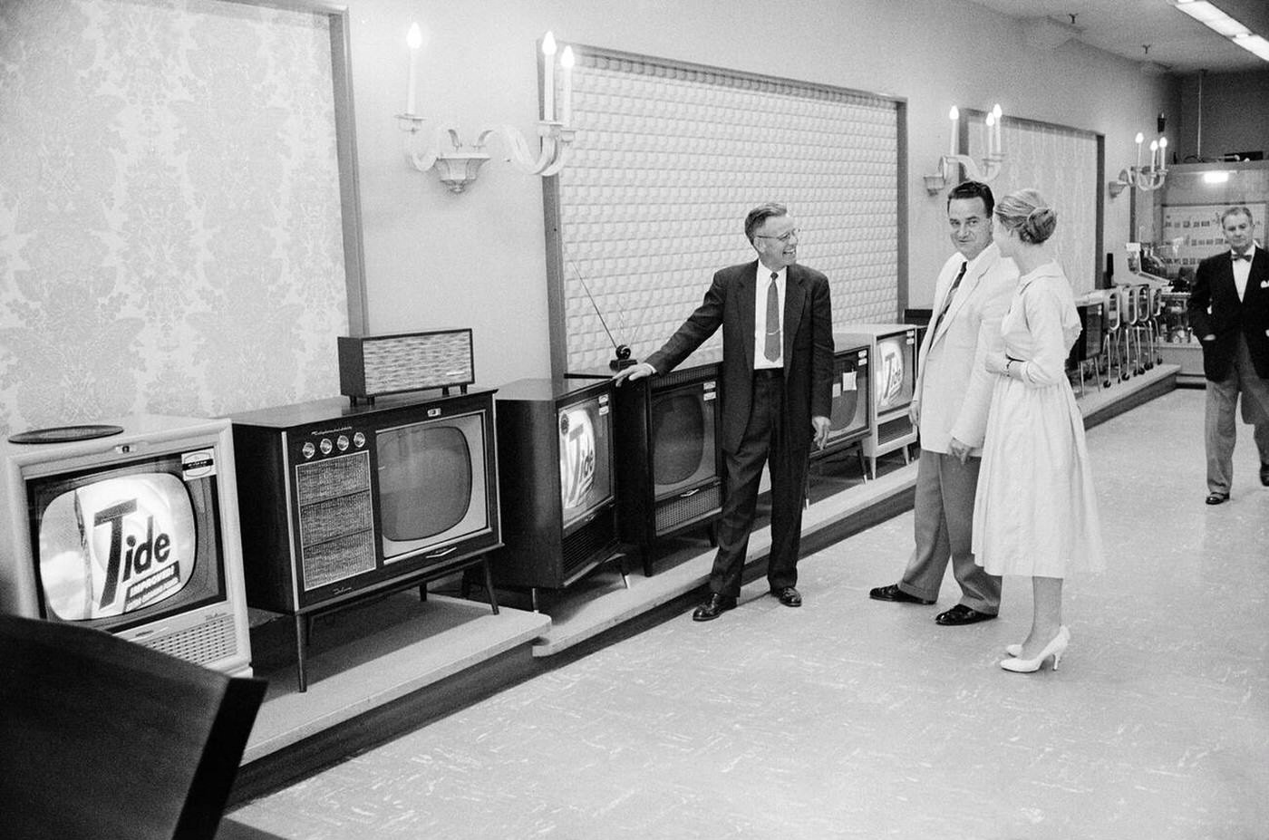 Couple shopping for a television at Woodward &; Lothrop department store, Washington, D.C., 1958.