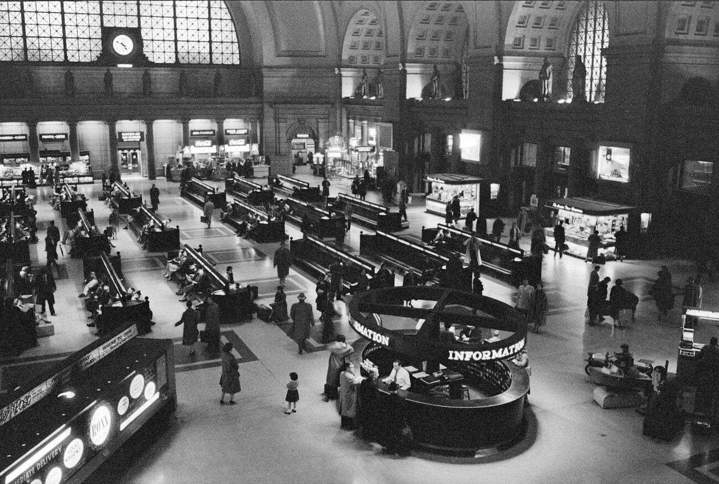 Interior view of Union Station showing waiting room, information booth and shops, Washington, D.C., 1958.