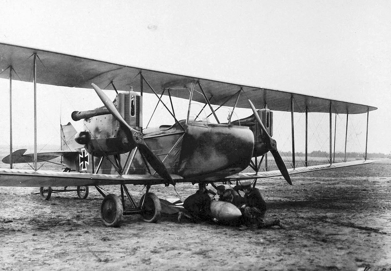 Attaching a 100 kg bomb to a German airplane.