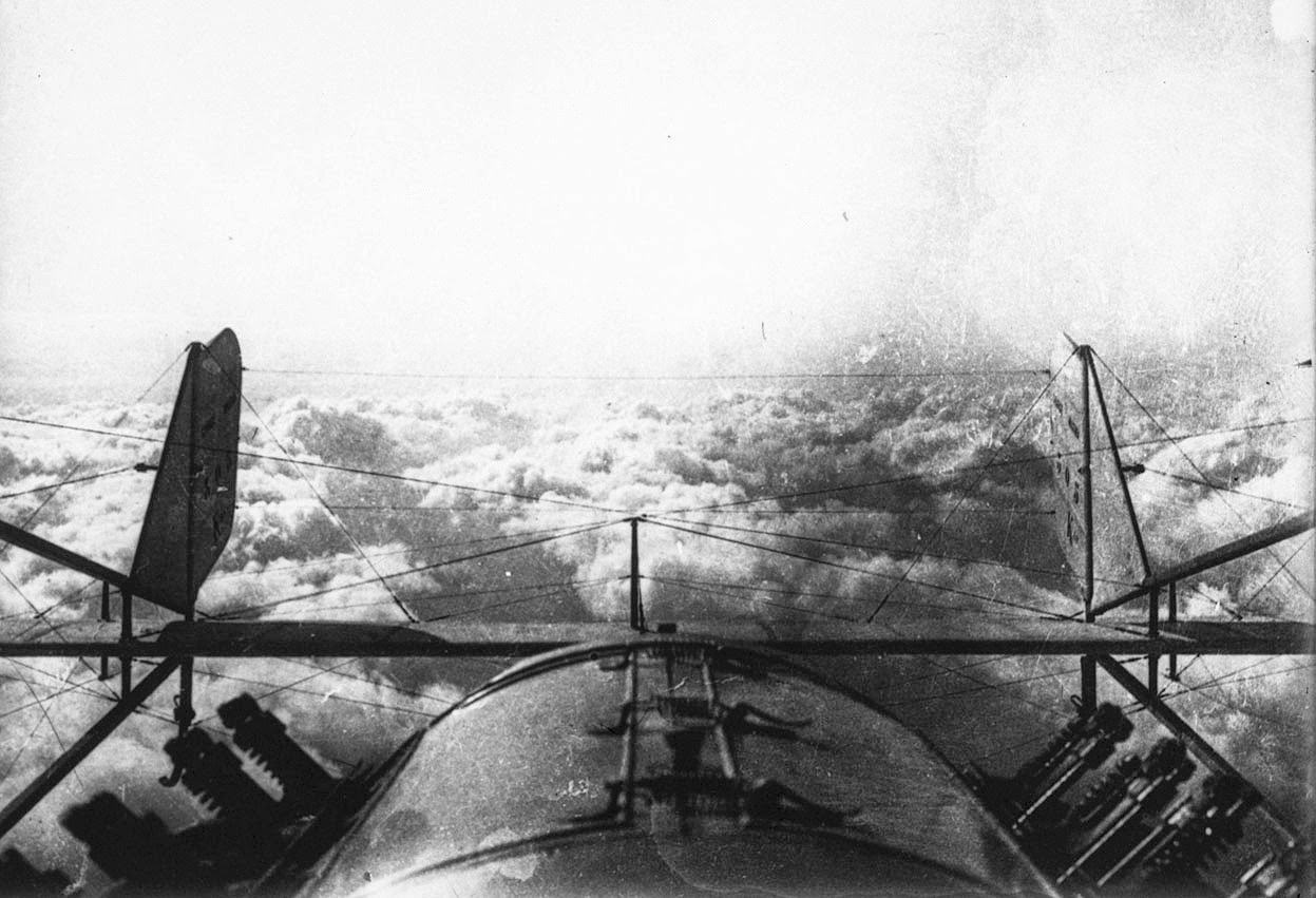 Returning from a reconnaissance flight during World War I, a view of the clouds from above.