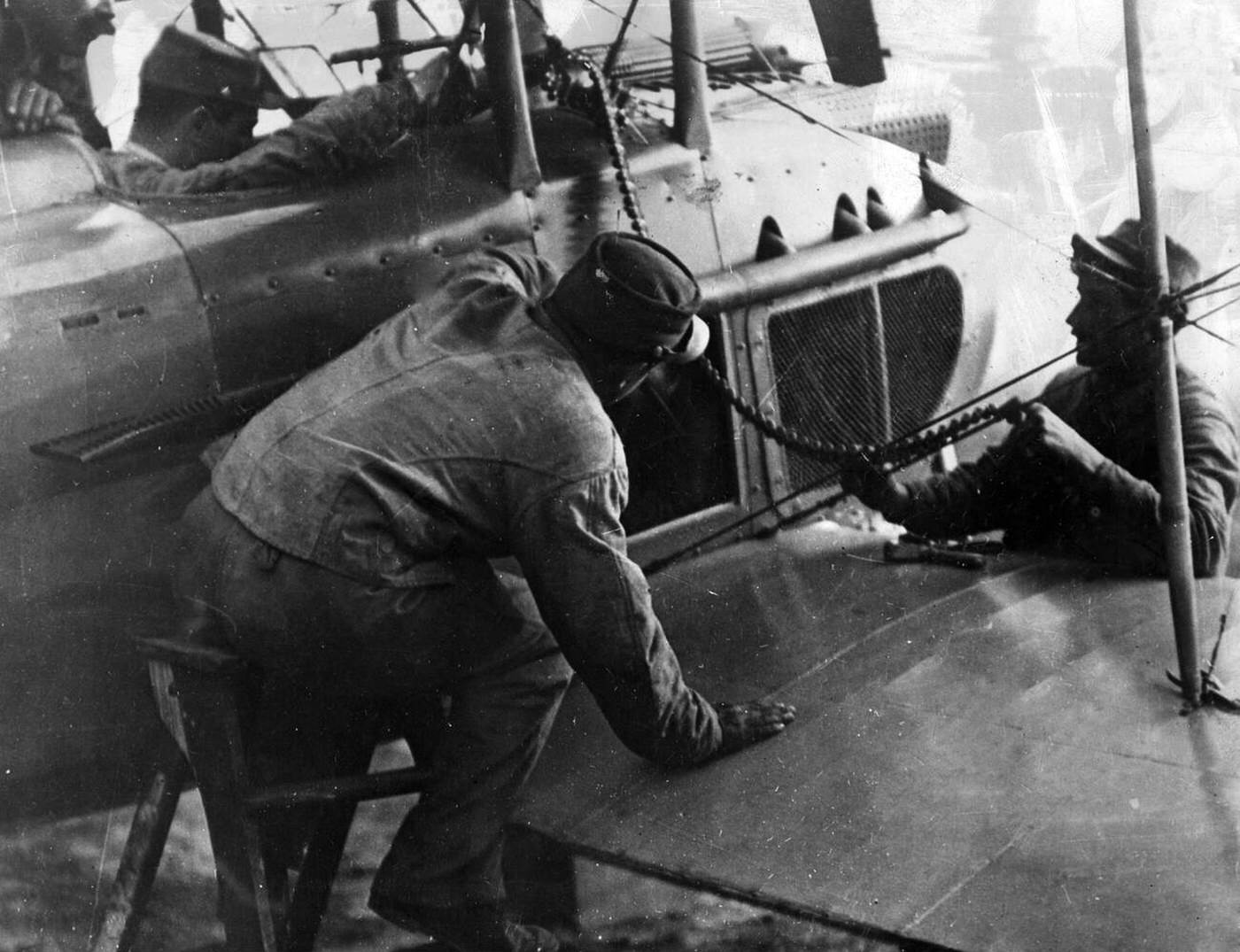 Work on an aircraft before take off in World War I, 1914-1918.